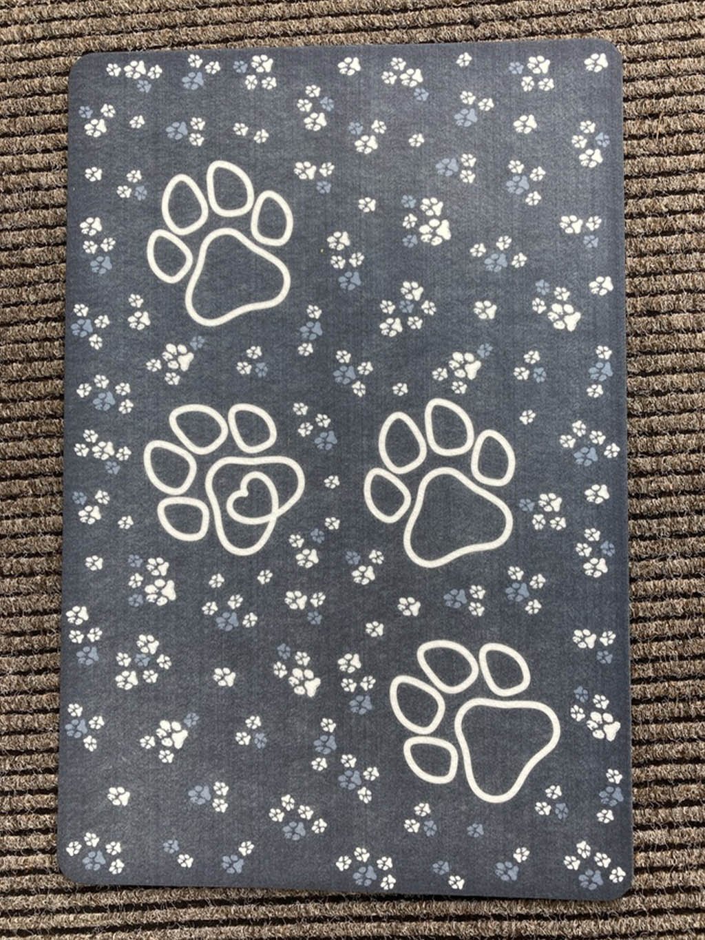 Doormat with white paws