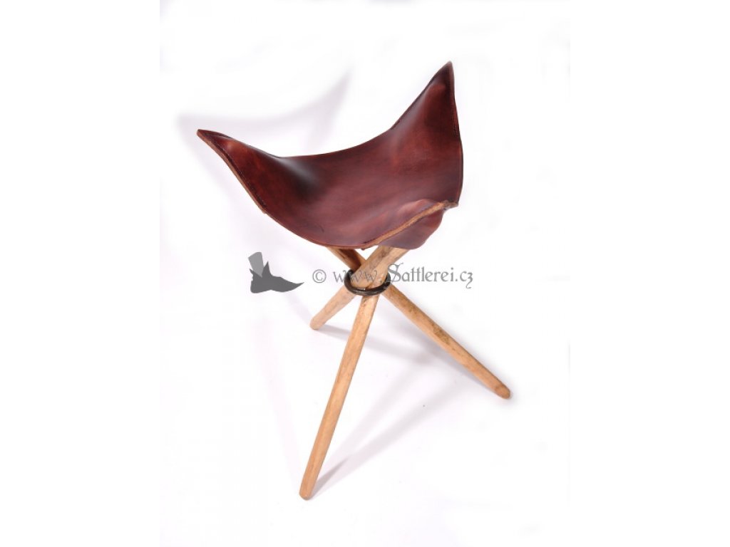 Tripod stool with leather seat.