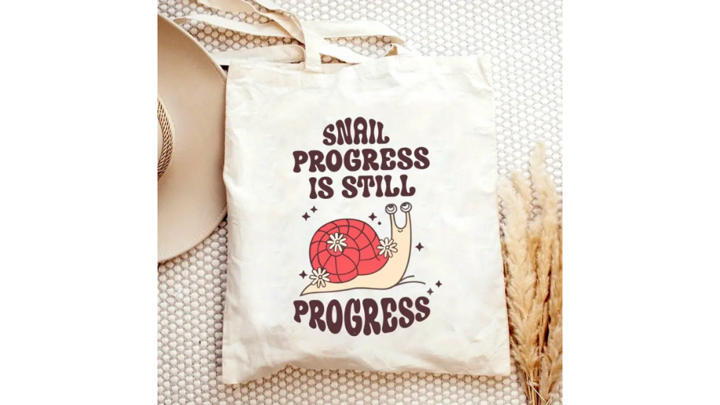 Weiße Segeltuchtasche „Snail Progress“