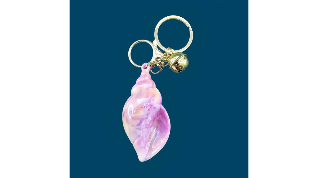 Iridescent keyring shell with bell