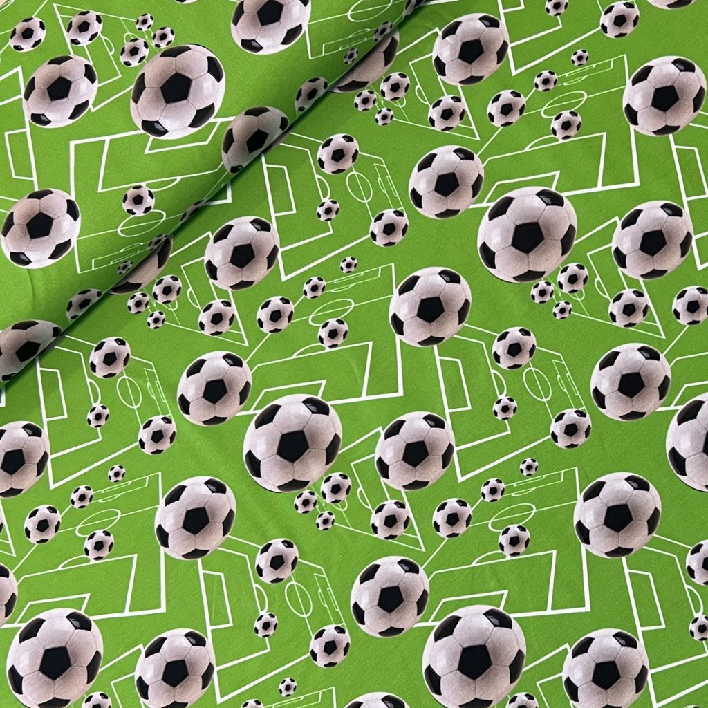 Fotbalové míče na zelené jersey
