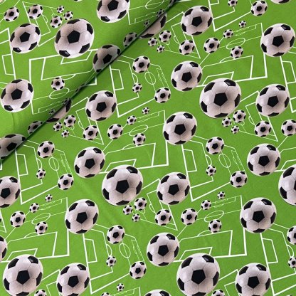 Fotbalové míče na zelené jersey