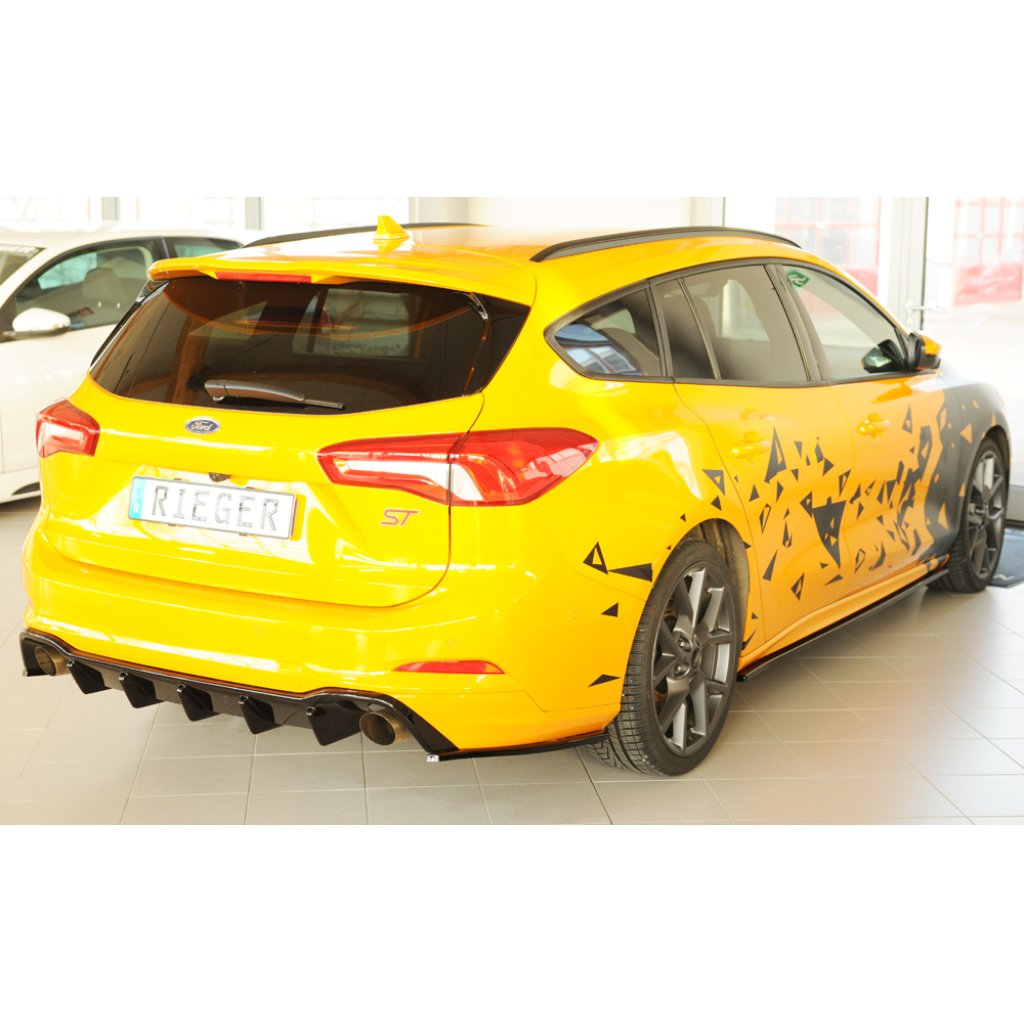Rieger spoiler pod zadní nárazník na levé straně pro Ford Focus 4 DEH 5-dvéř. (combi) r.v. 09/18-, plast ABS lakovaný do černé lesklé barvy